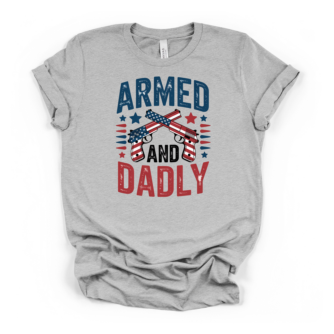 Armed and Dadly funny patriotic dad t-shirt in athletic heather with distressed crossed American flag pistols graphic in red white and blue