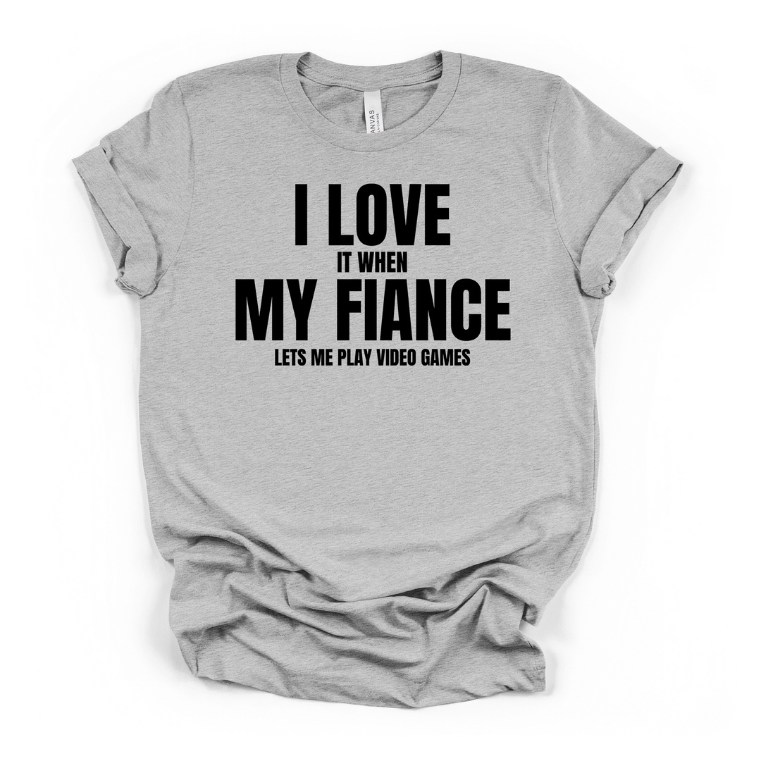 I Love It When My Fiance Lets Me Play Video Games funny gamer t-shirt in athletic heather with bold black lettering