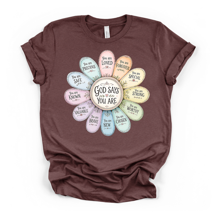 Heather maroon t-shirt featuring a colorful pastel flower with Christian affirmations on each petal and God Says You Are printed in the center