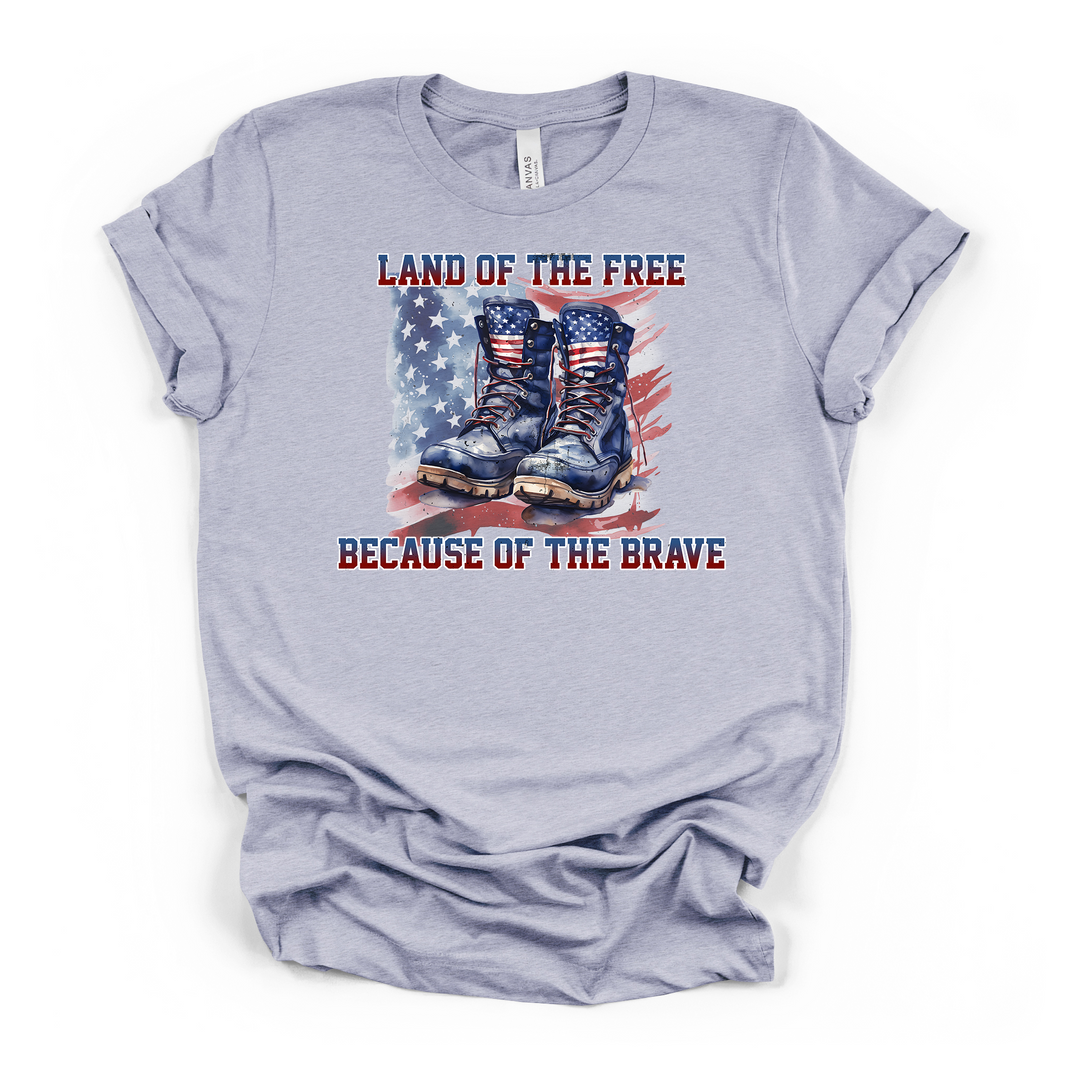 Heather blue t-shirt featuring patriotic military boots and American flag watercolor design with Land of the Free Because of the Brave text