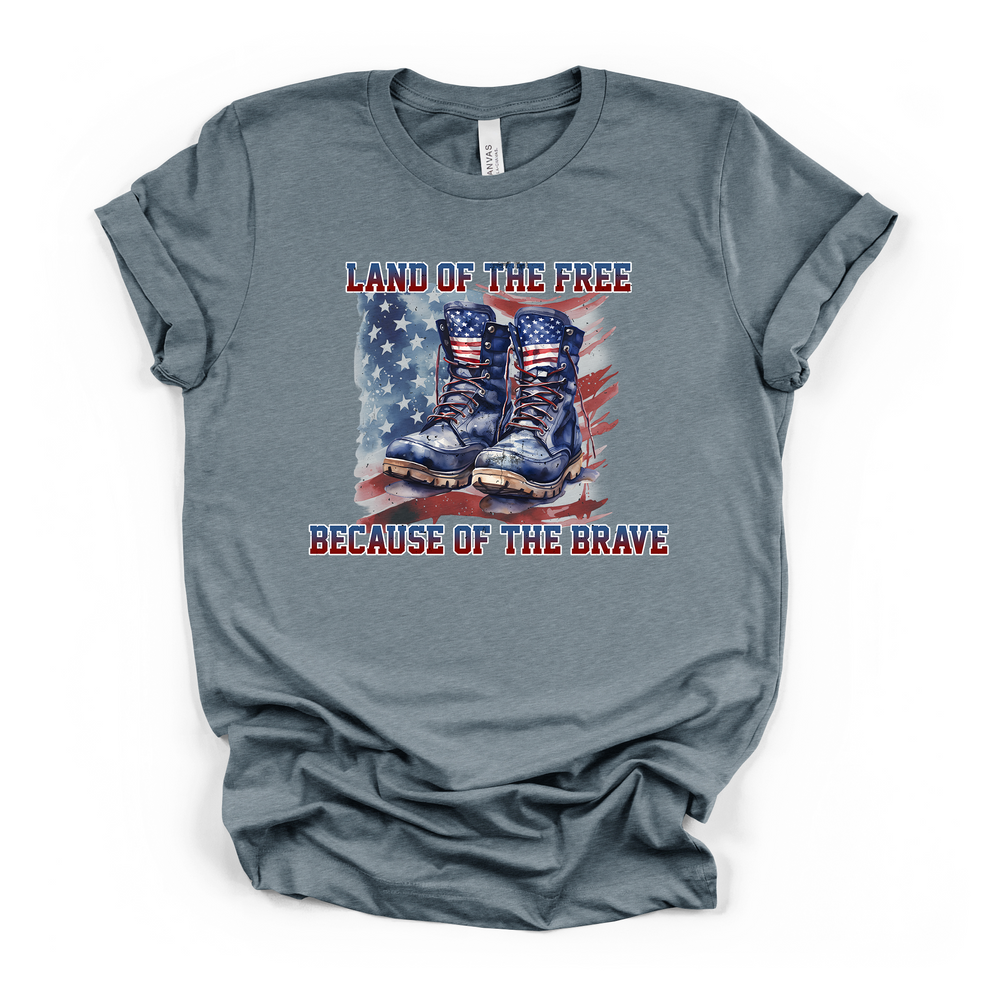 Heather slate t-shirt with bold watercolor military boots and American flag design and Land of the Free Because of the Brave text on the front