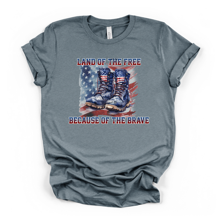 Heather slate t-shirt with bold watercolor military boots and American flag design and Land of the Free Because of the Brave text on the front