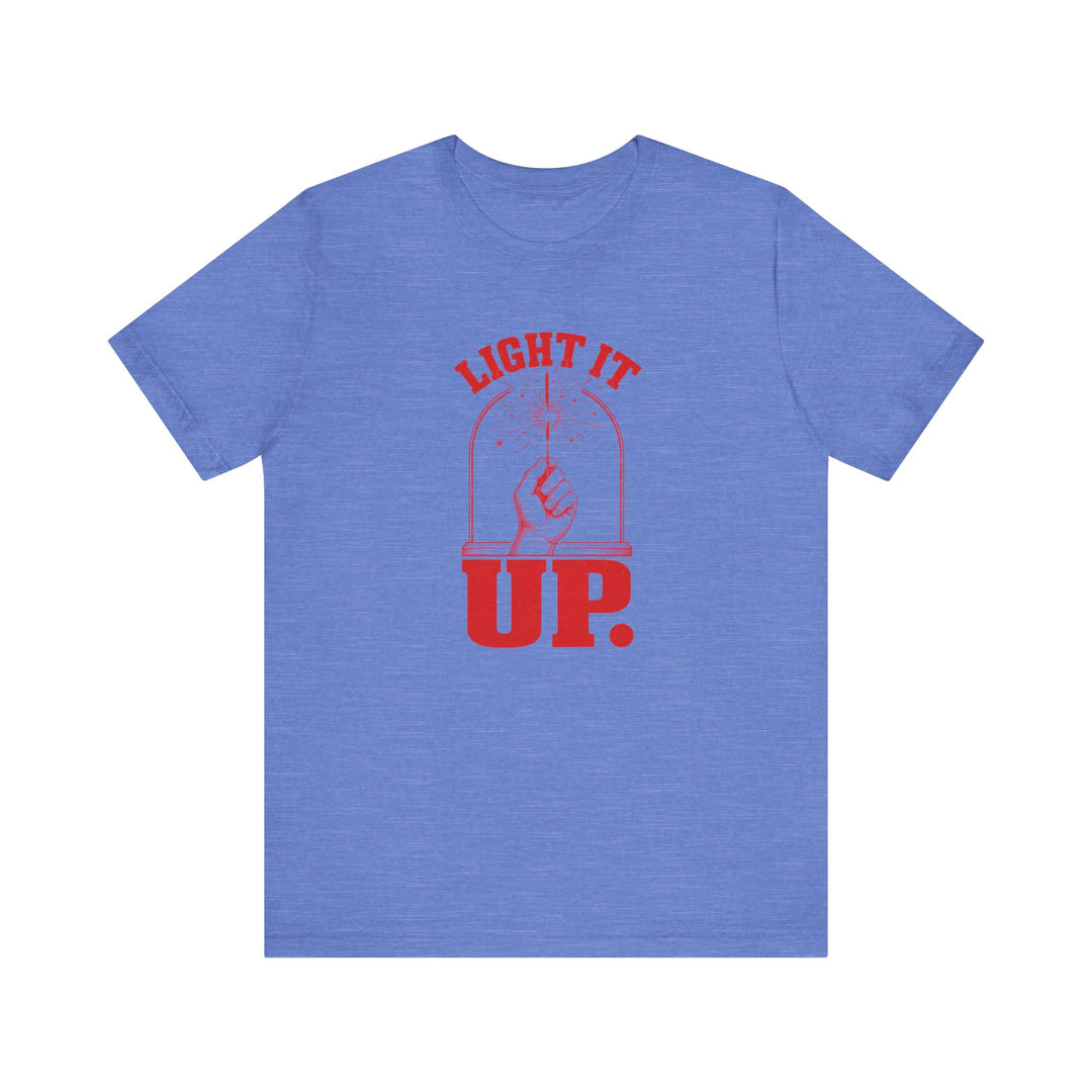 Blue t-shirt with hand holding sparkler dome graphic and bold red text reading Light It Up