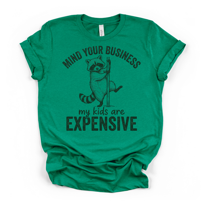 Heather kelly green t-shirt featuring a raccoon on a pole and Mind Your Business My Kids Are Expensive funny mom text on the front