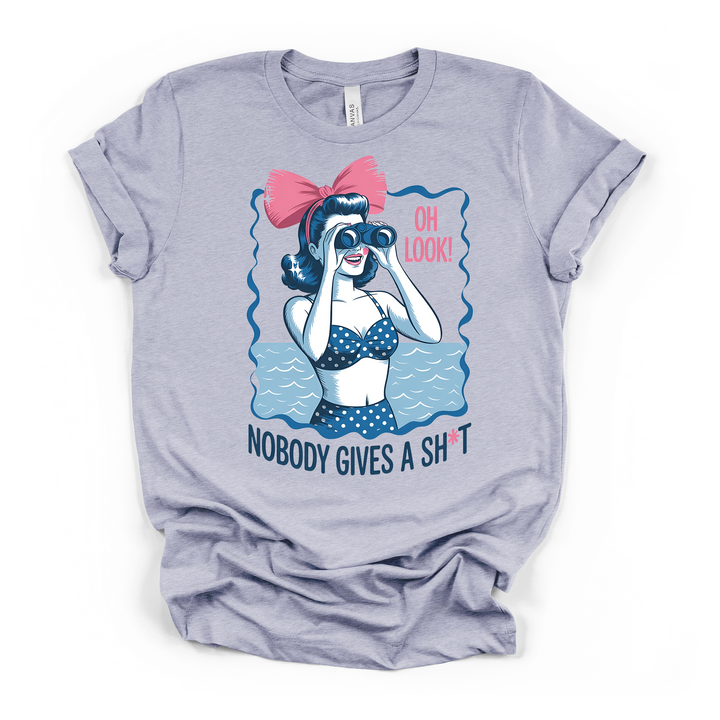 Heather blue t-shirt featuring a vintage pin-up woman with binoculars in a polka dot swimsuit and Oh Look Nobody Gives a Sht funny text on the front
