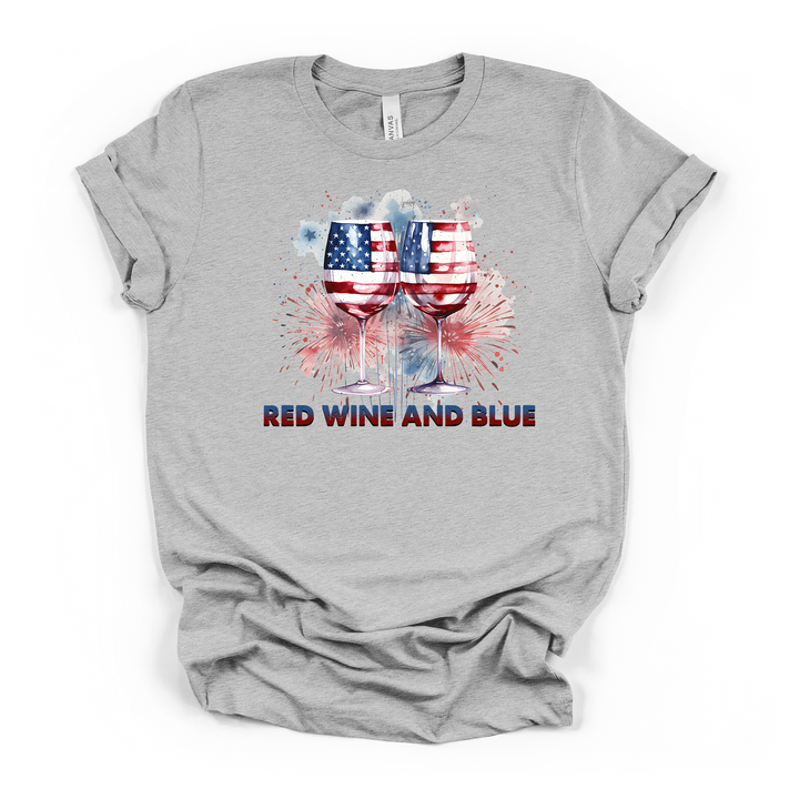 Athletic heather t-shirt with two American flag wine glasses clinking surrounded by watercolor fireworks and the text Red Wine and Blue