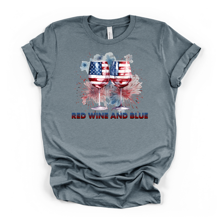 Heather slate t-shirt featuring two American flag wine glasses with watercolor fireworks and Red Wine and Blue text printed on the front