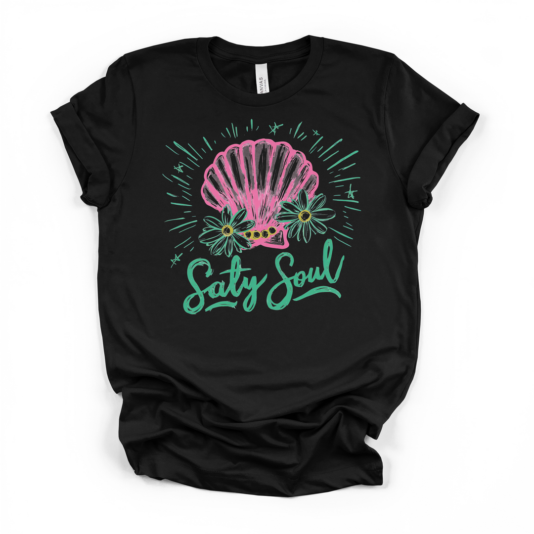 Salty Soul seashell graphic t-shirt in black, featuring pink shell, daisies, and teal script lettering