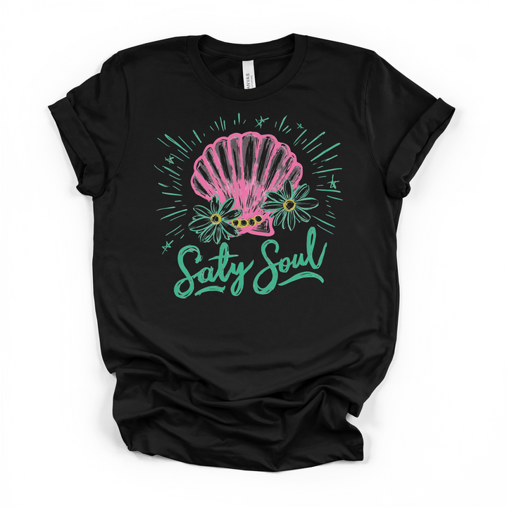 Salty Soul seashell graphic t-shirt in black, featuring pink shell, daisies, and teal script lettering