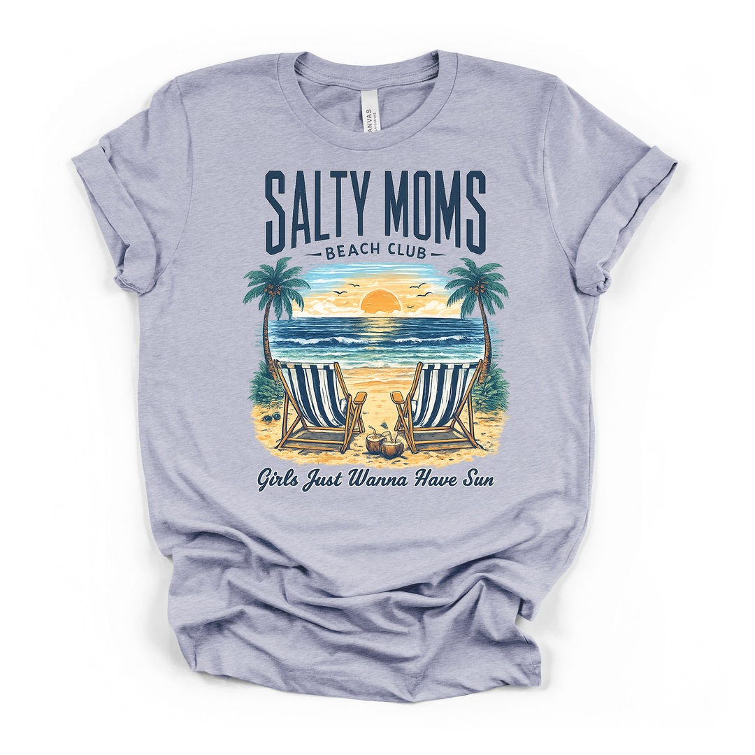 Heather blue t-shirt with a colorful beach sunset graphic with palm trees and striped chairs and Salty Moms Beach Club Girls Just Wanna Have Sun printed on front