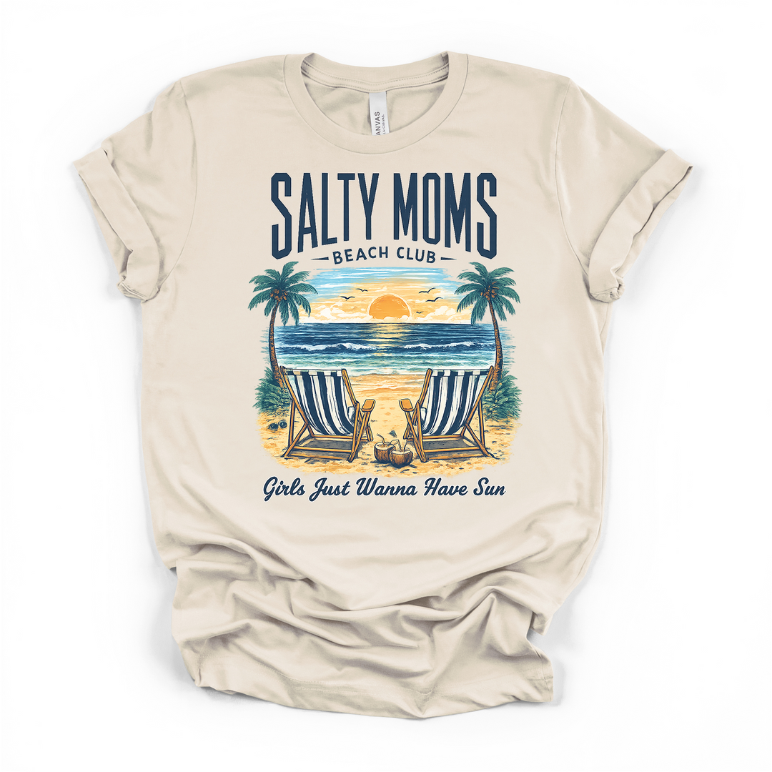 Natural cream t-shirt with a tropical beach sunset scene featuring two striped chairs and palm trees with Salty Moms Beach Club and Girls Just Wanna Have Sun text