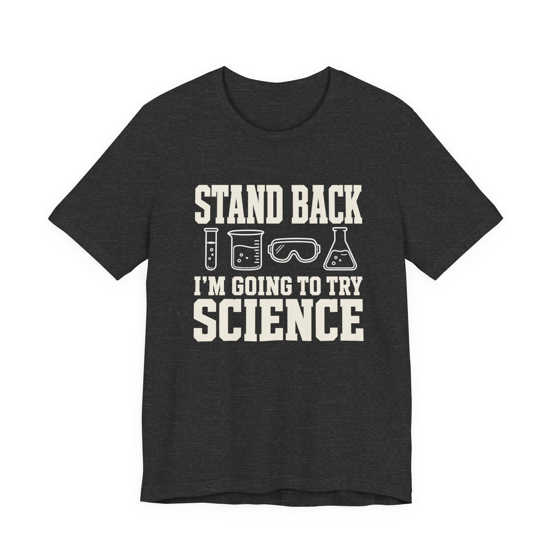 Dark heather t-shirt with lab equipment icons and bold cream text reading Stand Back I&