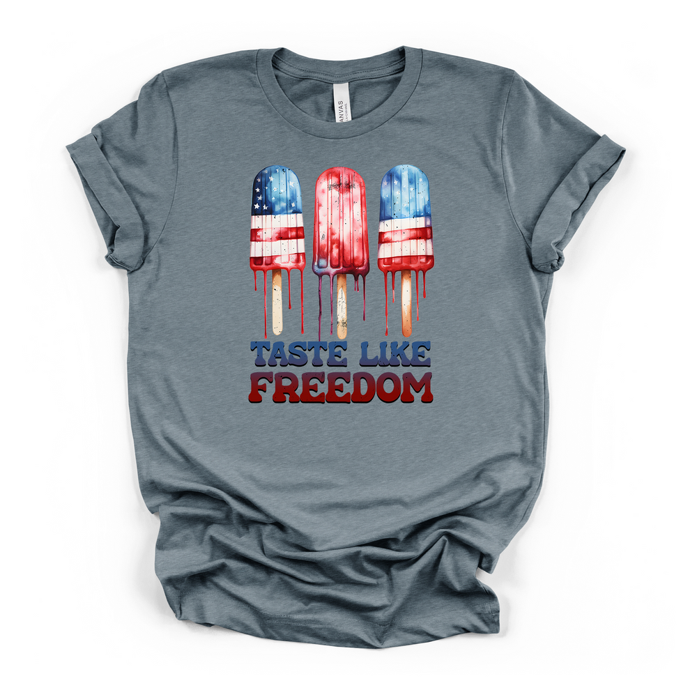 Heather slate t-shirt with three dripping red white and blue American flag popsicles and Taste Like Freedom text printed on the front