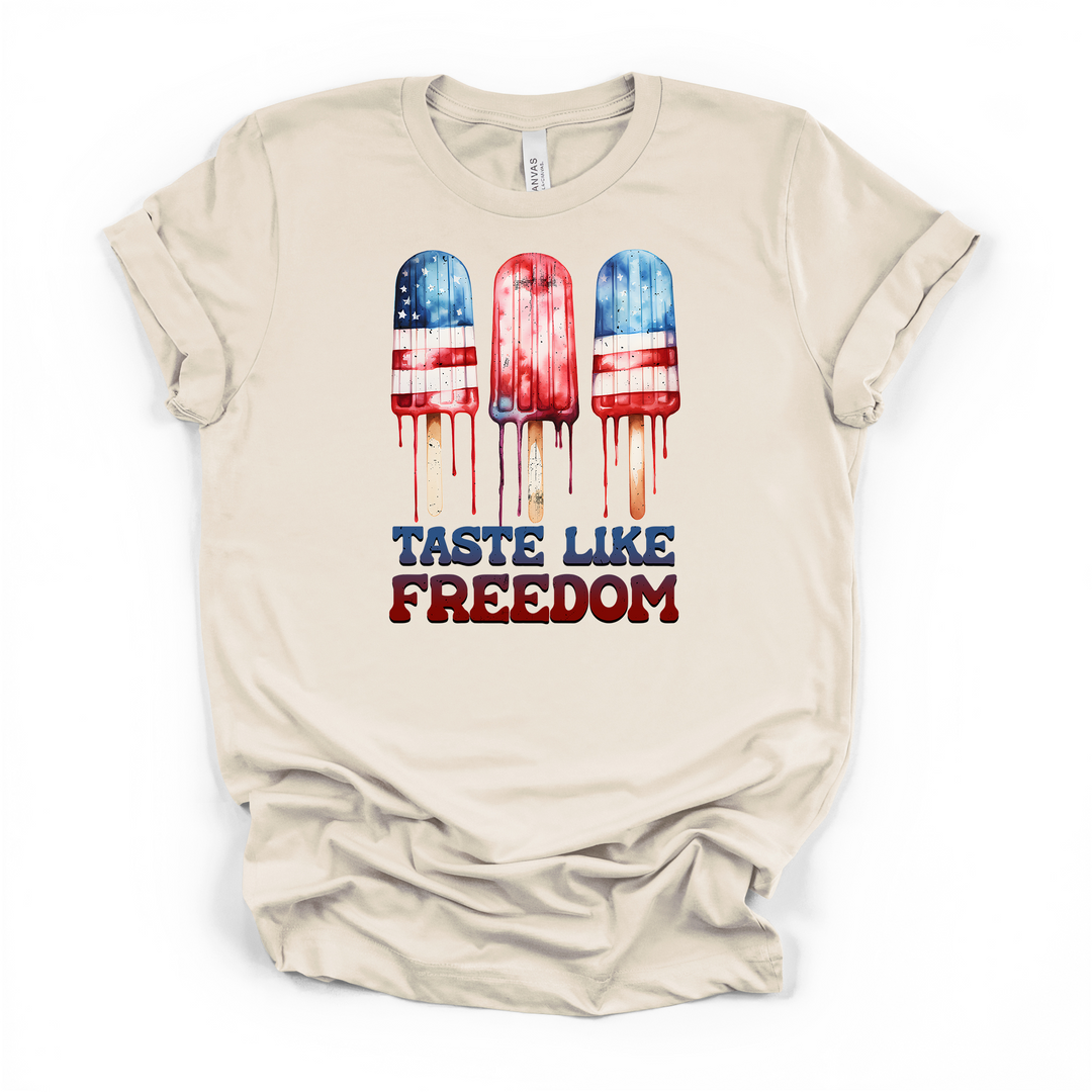 Natural cream t-shirt featuring three melting patriotic popsicles in red white and blue with Taste Like Freedom text below