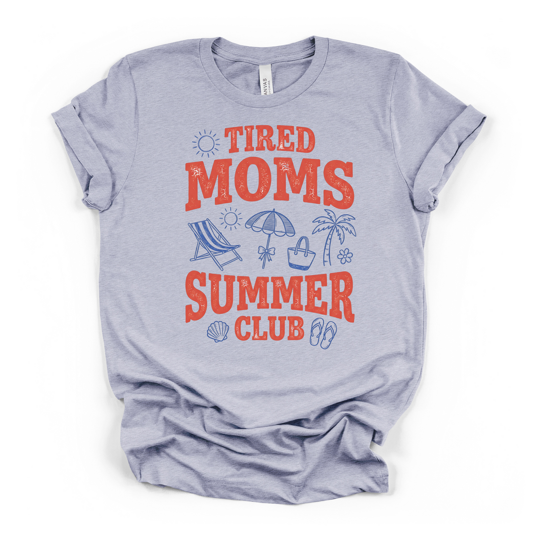 Heather blue t-shirt featuring distressed red Tired Moms Summer Club lettering with blue beach illustrations including flip flops a shell and palm tree