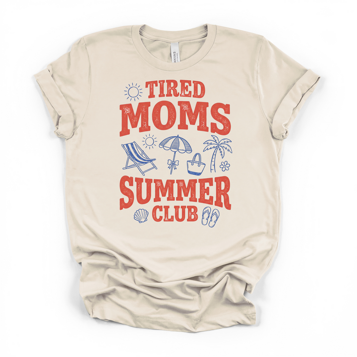 Natural cream t-shirt with a retro Tired Moms Summer Club graphic in red and blue with beach icons including a chair umbrella palm tree and seashell