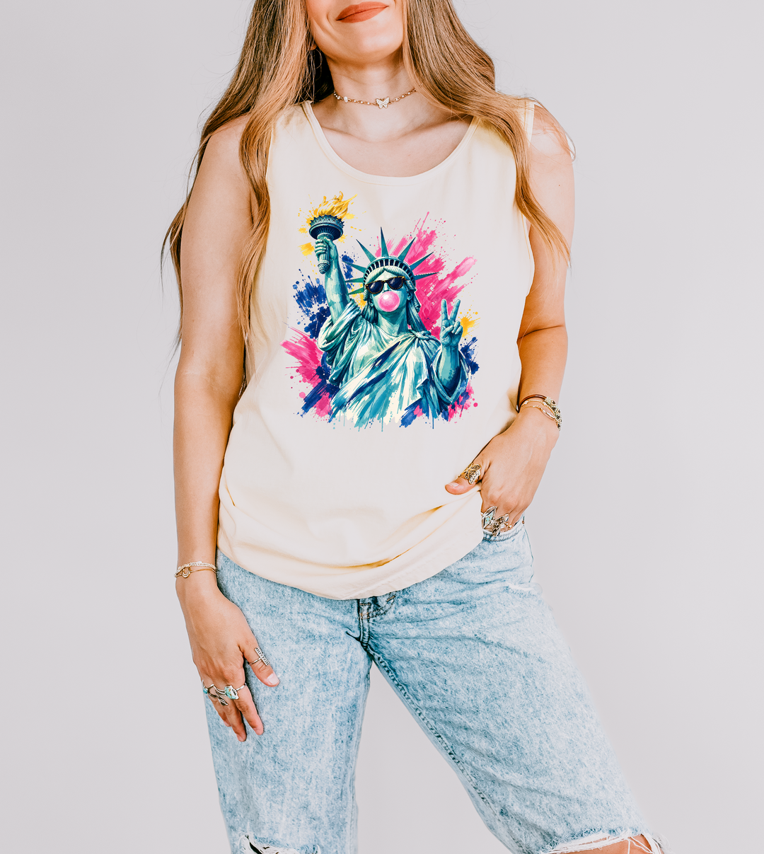 Bubblegum Liberty patriotic tank top in Ivory with a pop art Statue of Liberty wearing sunglasses blowing bubblegum and flashing a peace sign