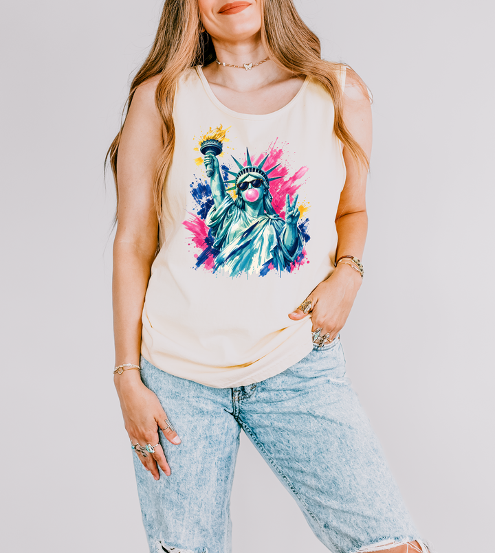 Bubblegum Liberty patriotic tank top in Ivory with a pop art Statue of Liberty wearing sunglasses blowing bubblegum and flashing a peace sign