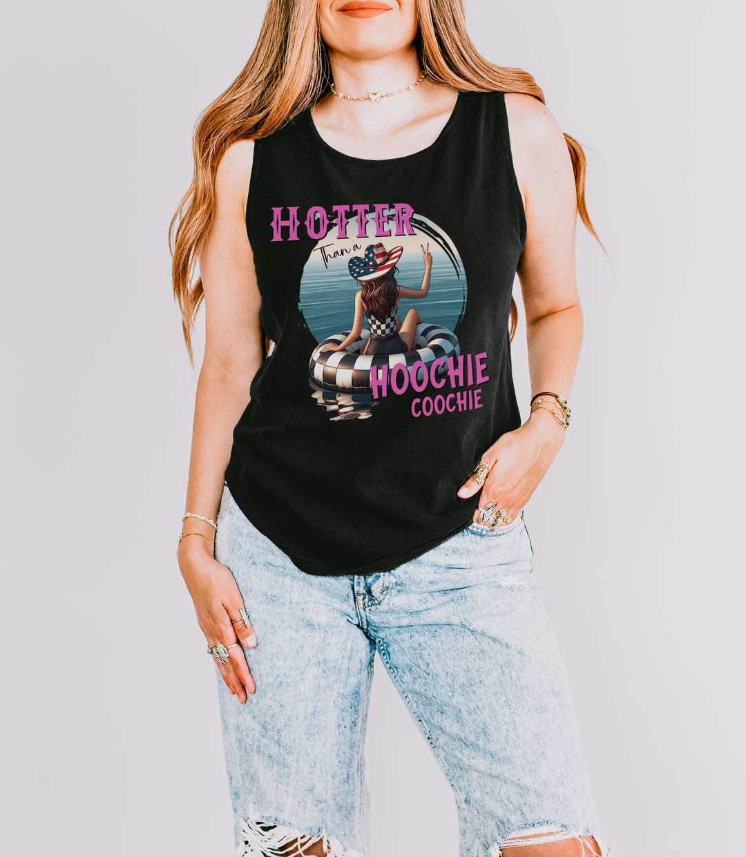 Hotter Than a Hoochie Coochie funny summer tank top in Black with pink retro text and a cowgirl on a checkered pool float