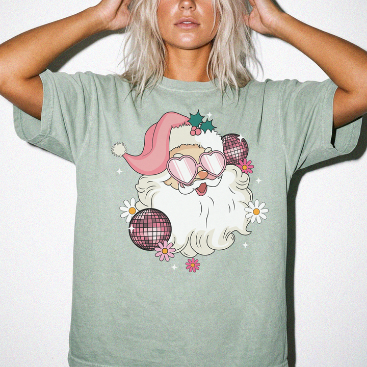 Retro Disco Santa Christmas shirt in Bay green with a groovy Santa wearing heart sunglasses surrounded by disco balls and daisies