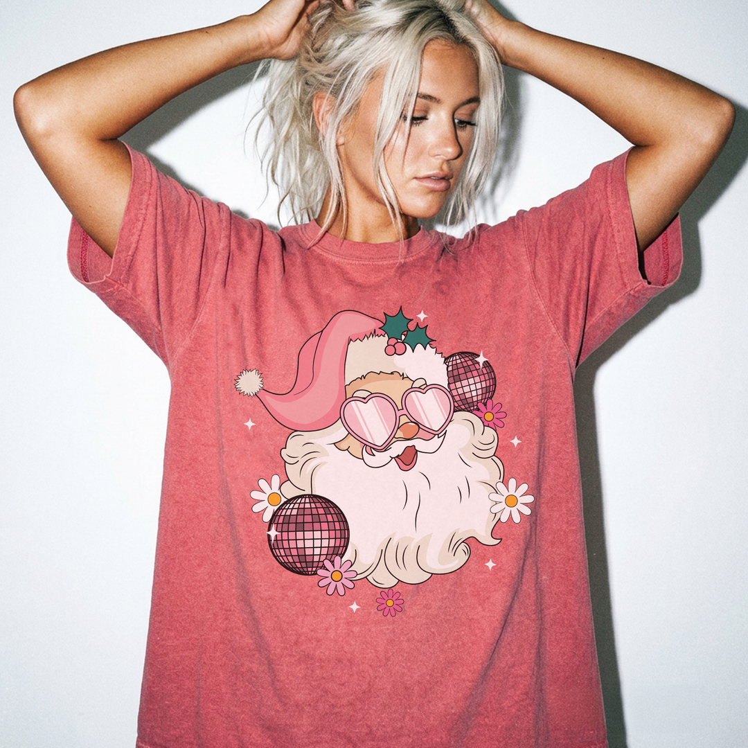 Retro Disco Santa Christmas shirt in Watermelon red with a groovy Santa wearing heart sunglasses surrounded by disco balls and daisies