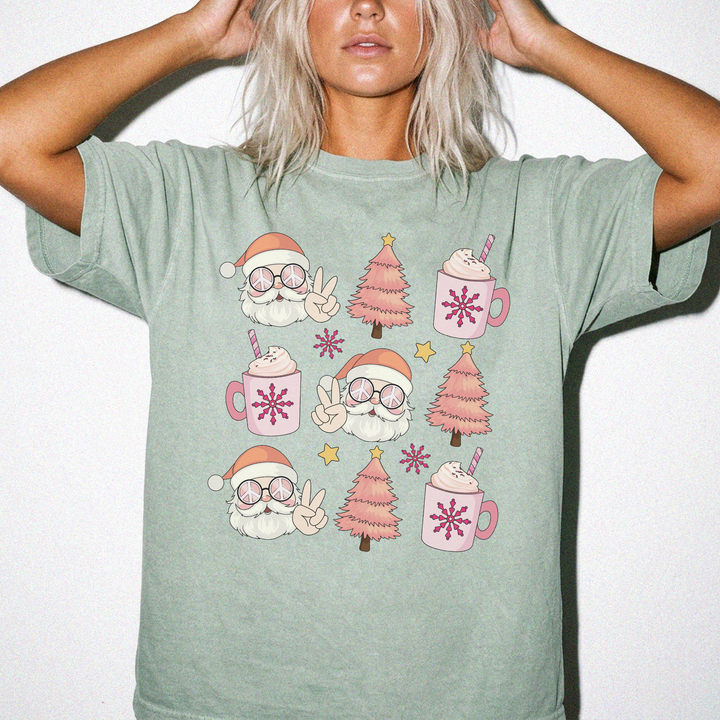 Retro Santa Cocoa Christmas shirt in Bay green featuring groovy Santas, pink Christmas trees, cocoa mugs, and snowflakes