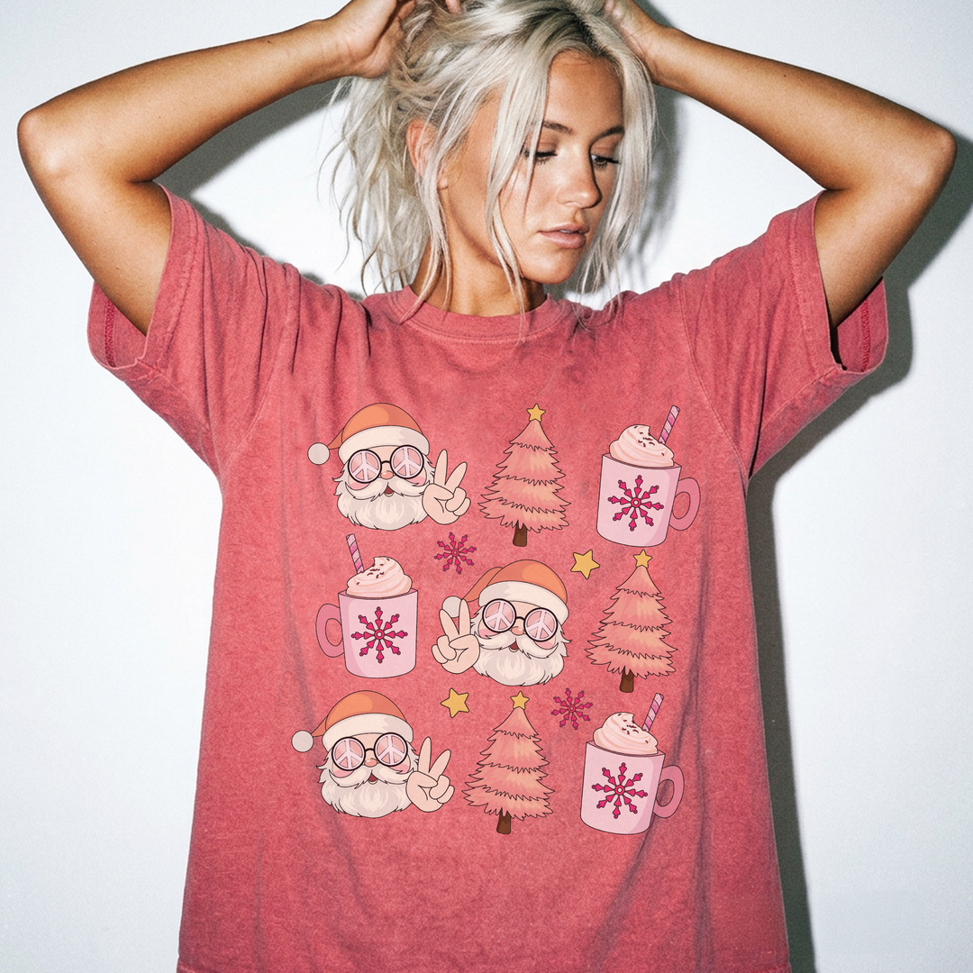 Retro Santa Cocoa Christmas shirt in Watermelon red featuring groovy Santas, pink Christmas trees, cocoa mugs, and snowflakes